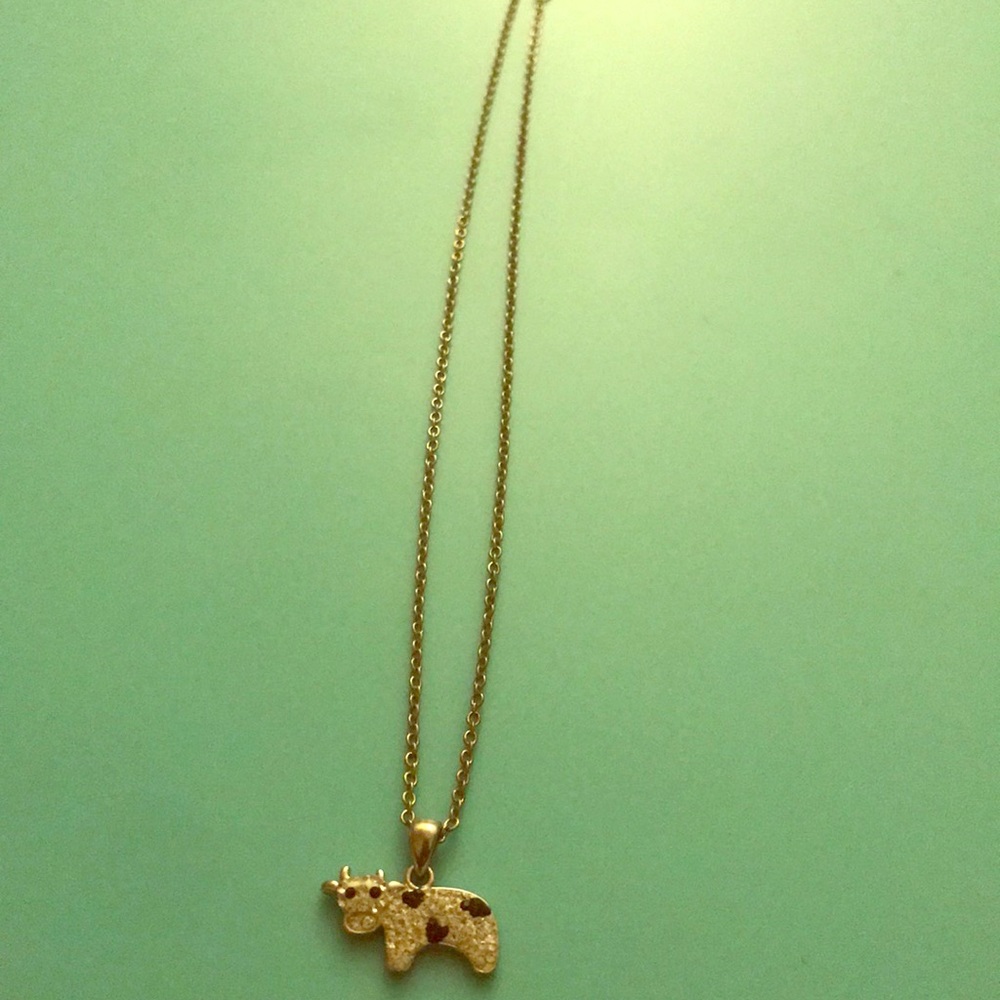 Silver cow necklace